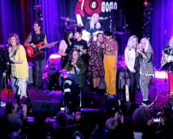 The band performing one of their newer songs "When We Need Her" with some help from Kathy Valentine of the Go Gos, Cherie Currie of The Runaways, and in the center an all-girl band called the Linda Lindas.