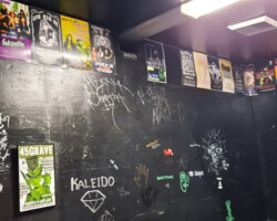The walls of the green rooms at the Whisky a Go Go are covered with signatures, posters, and stickers from the many bands and their crew members.