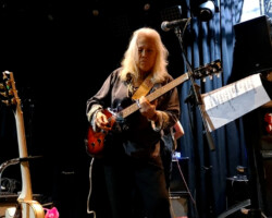 June crankin' it up during the sound check as she plays some slide during the intro of Fanny's version of "Ain't That Peculiar". The audio guy wanted her loudest level and that riff certainly takes it to 11.