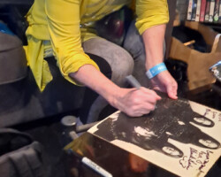 Patti Quatro signing my album cover for me. She plays a really cool Gibson SG guitar that she's decorated over the years. SG's rock (says the owner of an SG bass clone).