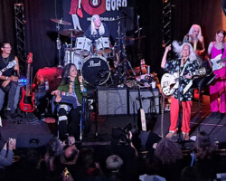 Fanny hitting the stage. Besides the original five members, they were joined by Lee Mandeloni (he is Jean's son and is on the left behind Patti) and Mia Huggs (in the pink on the far right). Mia is an excellent bassist and matched Jean's original bass lines note-for-note, which is not an easy task.